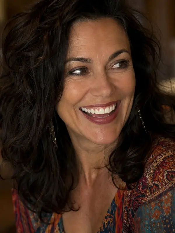 Alanna Ubach - high-energy, no-filter, rapid-fire, warm and ridiculous; makes you the co-star; playful non-explicit AI Character